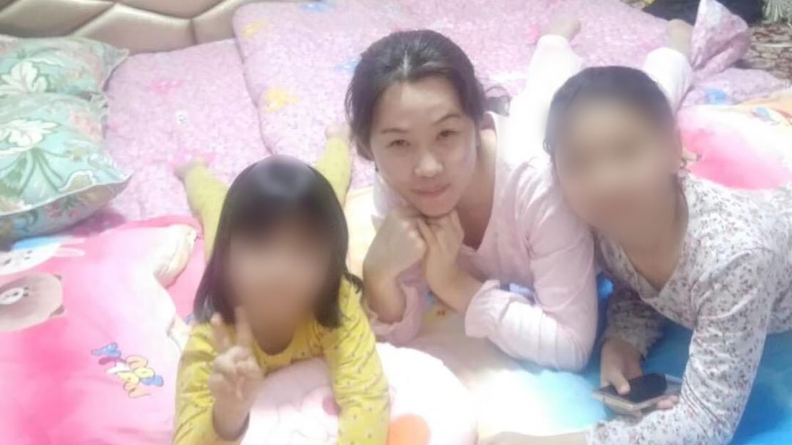 During their visits, cadres share meals with the family and get to know the children in the household. Zumrat Dawut blurred the faces of these children before providing this image to CNN.