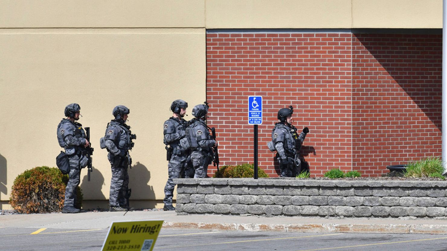 SWAT team officers respond to the scene of a reported hostage situation at the Wells Fargo branch Thursday.