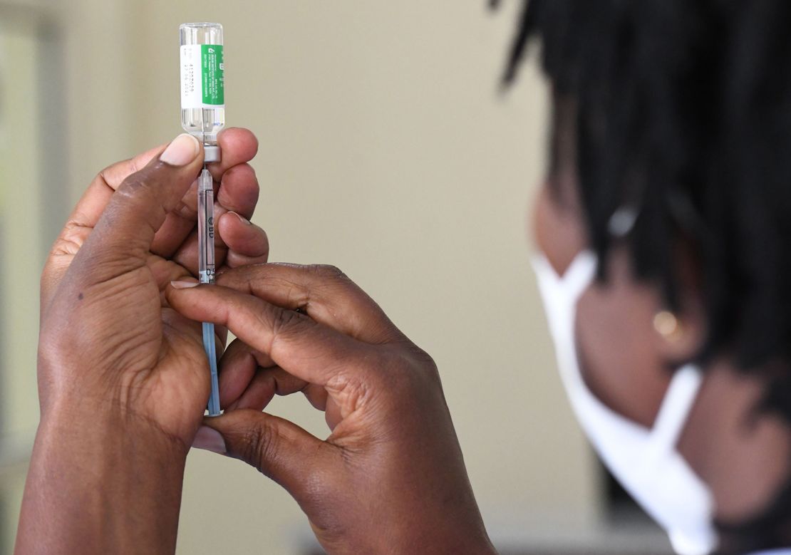 A Kenyan health worker prepares to administer the AstraZeneca vaccine to a colleague at Kenyatta National Hospital in Nairobi on March 5, 2021. Kenya has used up more than 90% of its stock of the vaccine, supplied by COVAX.