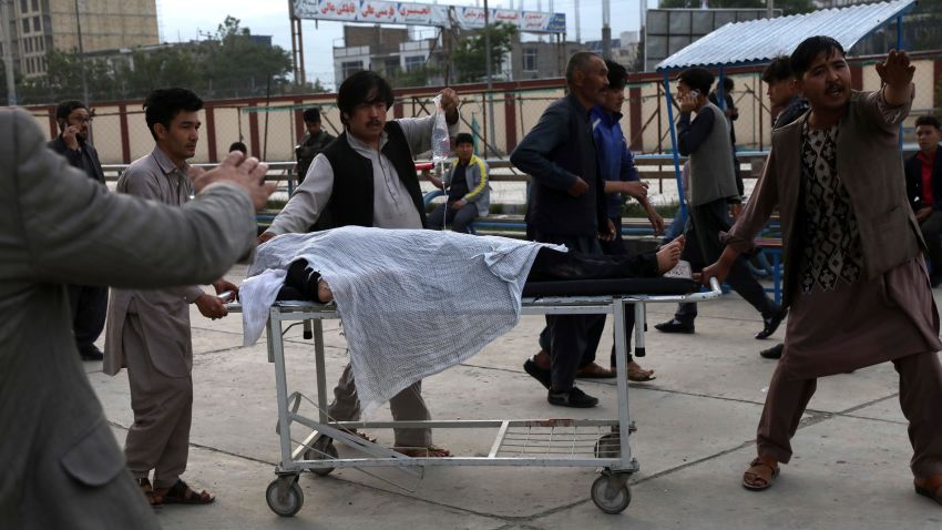 An injured school student is transported to a hospital after a bomb explosion near a school in west of Kabul, Afghanistan, Saturday, May 8, 2021.   A bomb exploded near a school in west Kabul on Saturday, killing several people, many them young students, an Afghan government spokesmen said. (AP Photo/Rahmat Gul)