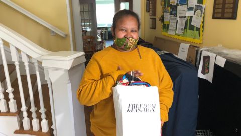 Mekides Mengesha, a resident of Alexandria House, poses with her Mother's Day gift bag.