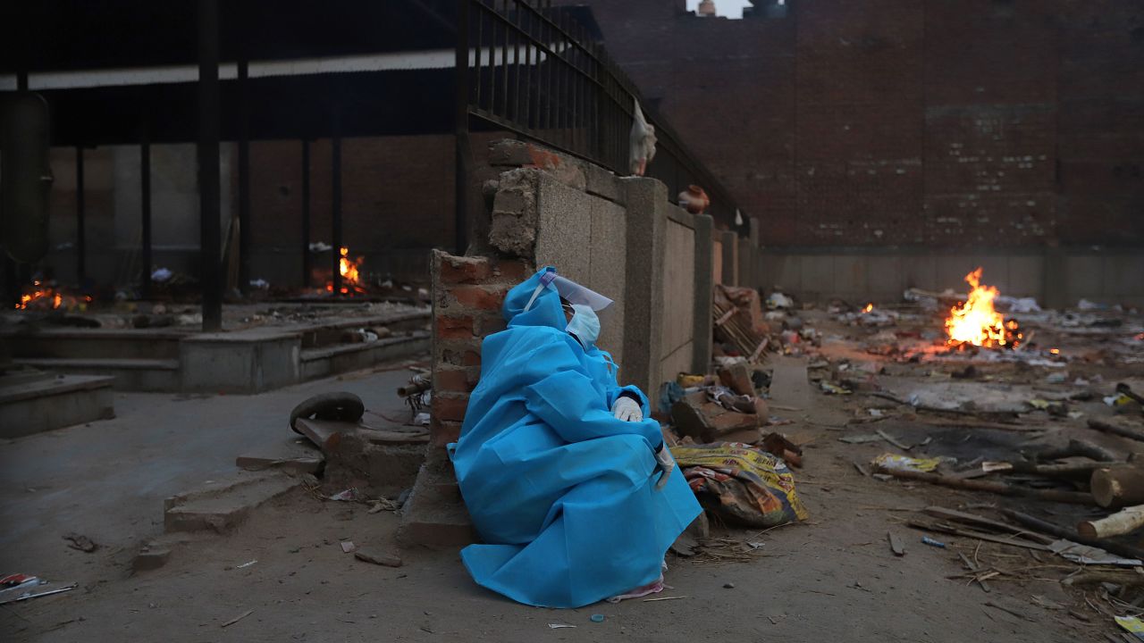 A woman at a crematorium in New Delhi, India, on May 8 mourns a relative who died from Covid-19.