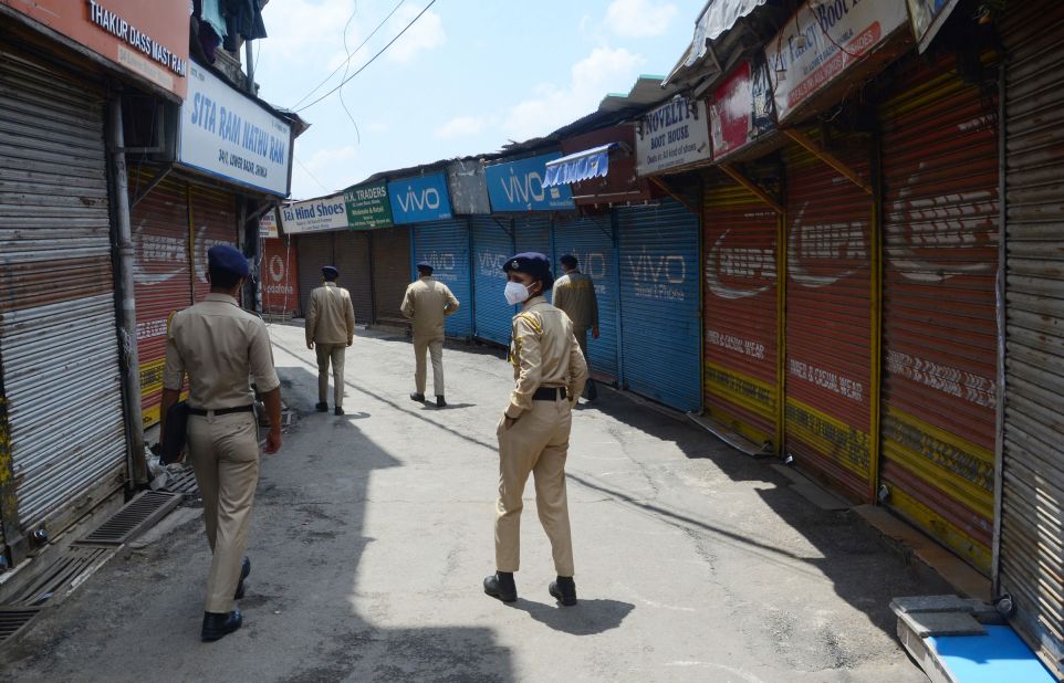 Police in Shimla patrol the streets of the Lower Bazaar area during a curfew on May 8.