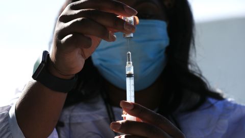 A DC Health nurse manager fills a syringe with a dose of the J&J Covid-19 vaccine in Washington, DC, on May 6, 2021.