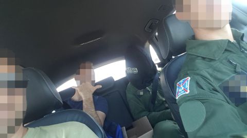 The pilot's lawyer said photos cited in the complaint were filmed by service members who were present, and the images later shared in a WhatsApp group chat.