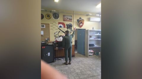 The complaint read the pilot was forced to inflate and wear an inflatable maritime overflight outfit, raise his arms and stand as a "human clock."
