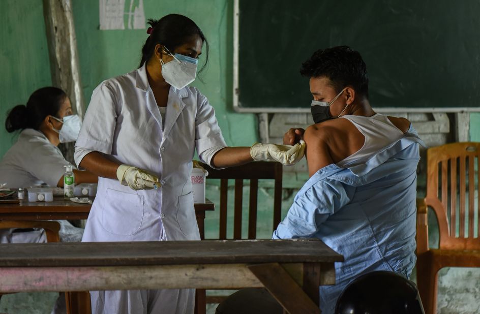 A young man receives a Covid-19 vaccine in Guwahati, India, on Saturday, May 8.