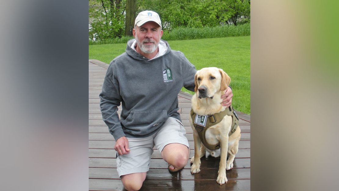 US Army vet Paul Whitmer, shown with his dog, Paul, now looks forward to going out in public.