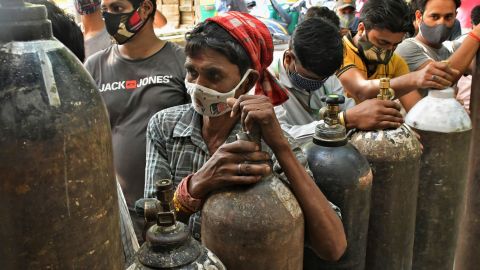Indians wait to refill oxygen cylinders for Covid-19 patients at a gas supplier facility in New Delhi on May 8.