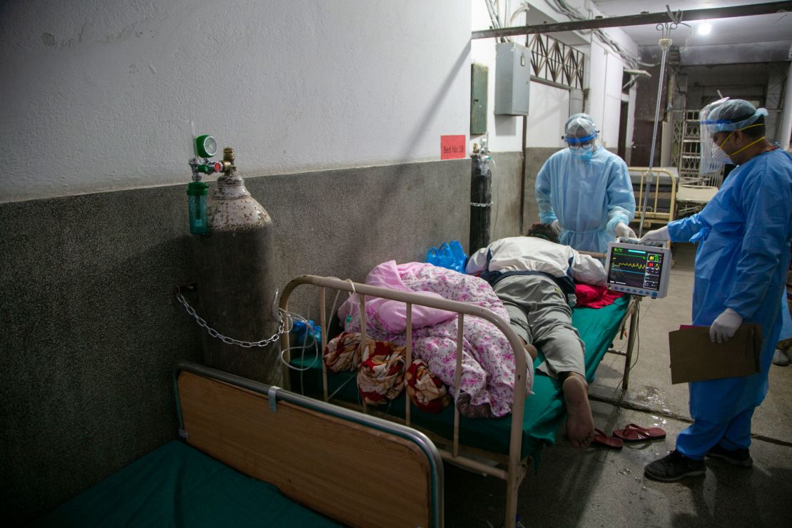 Nepali doctors treat a Covid-19 patient on the corridor of the emergency ward of a hospital in Kathmandu, Nepal on May 5.