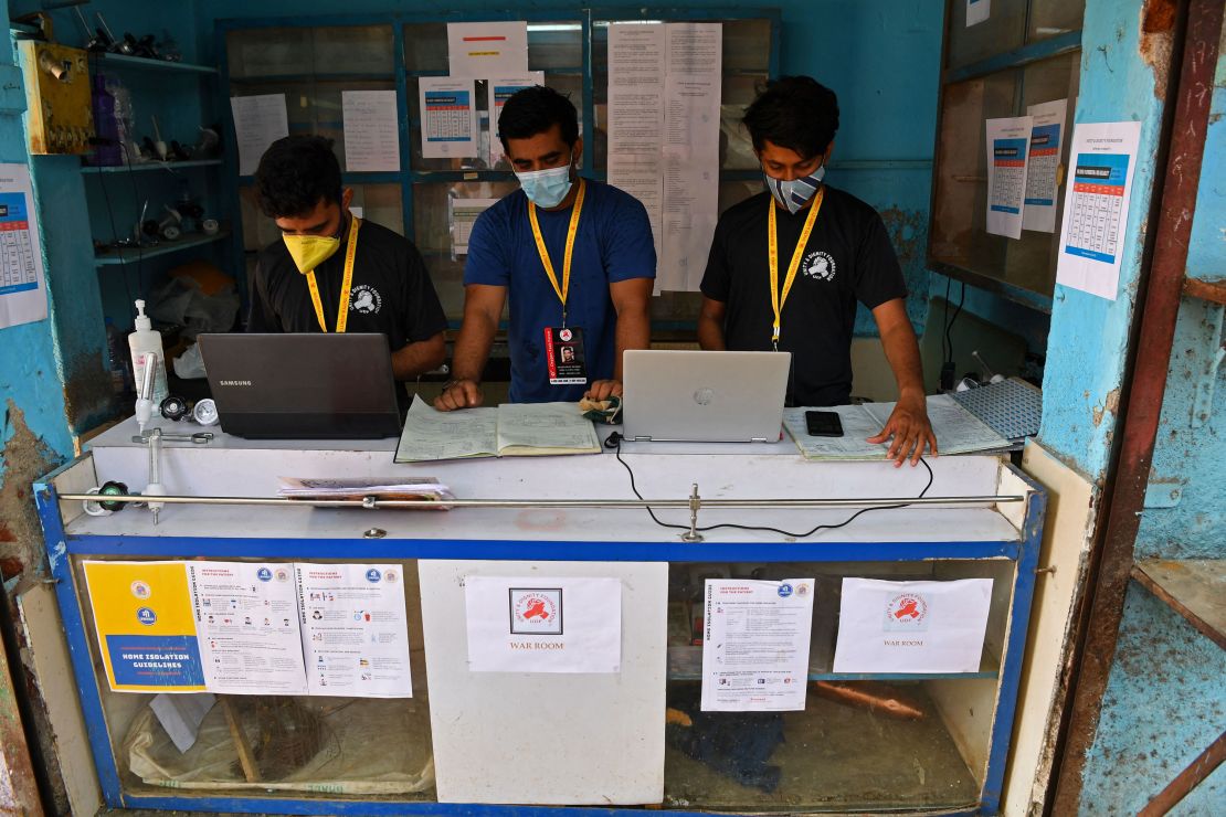 Shahnawaz Shaikh (C), manages data in his operating center that was previously a general store in Mumbai on April 28, 2021.