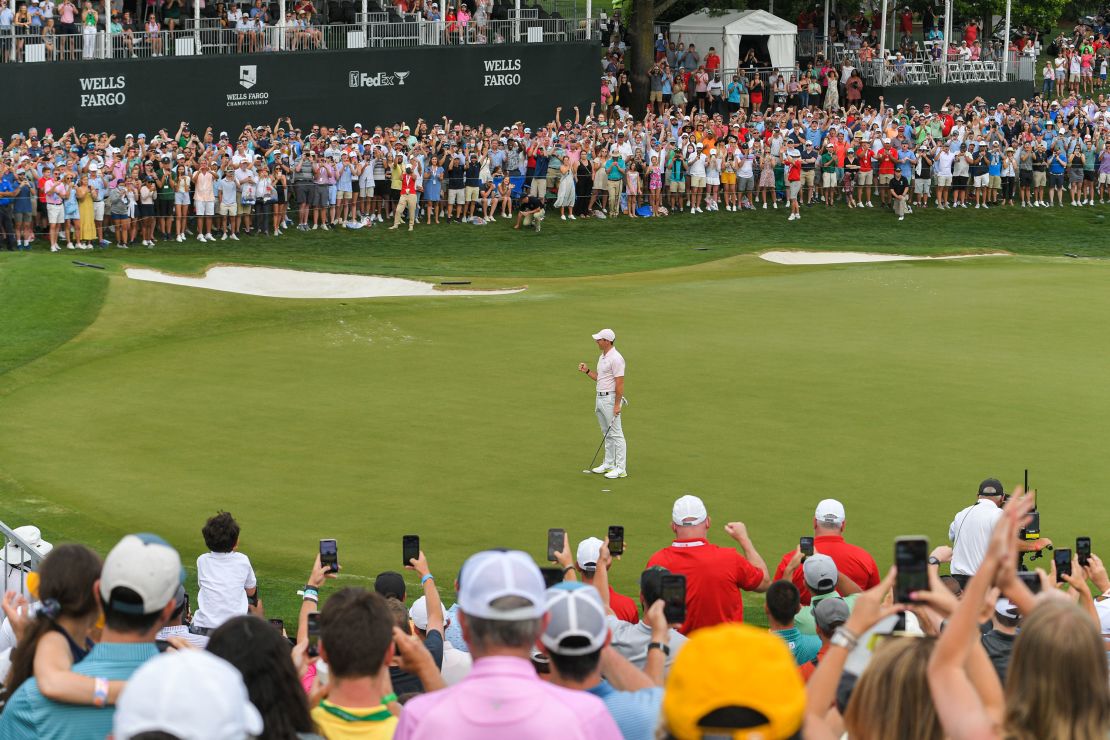 McIlroy fist pumps after making the winning putt on the 18th green at the Wells Fargo Championship.