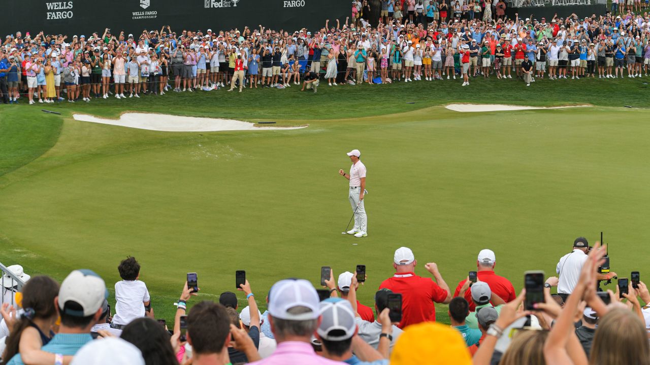 McIlroy fist pumps after making the winning putt on the 18th green at the Wells Fargo Championship.