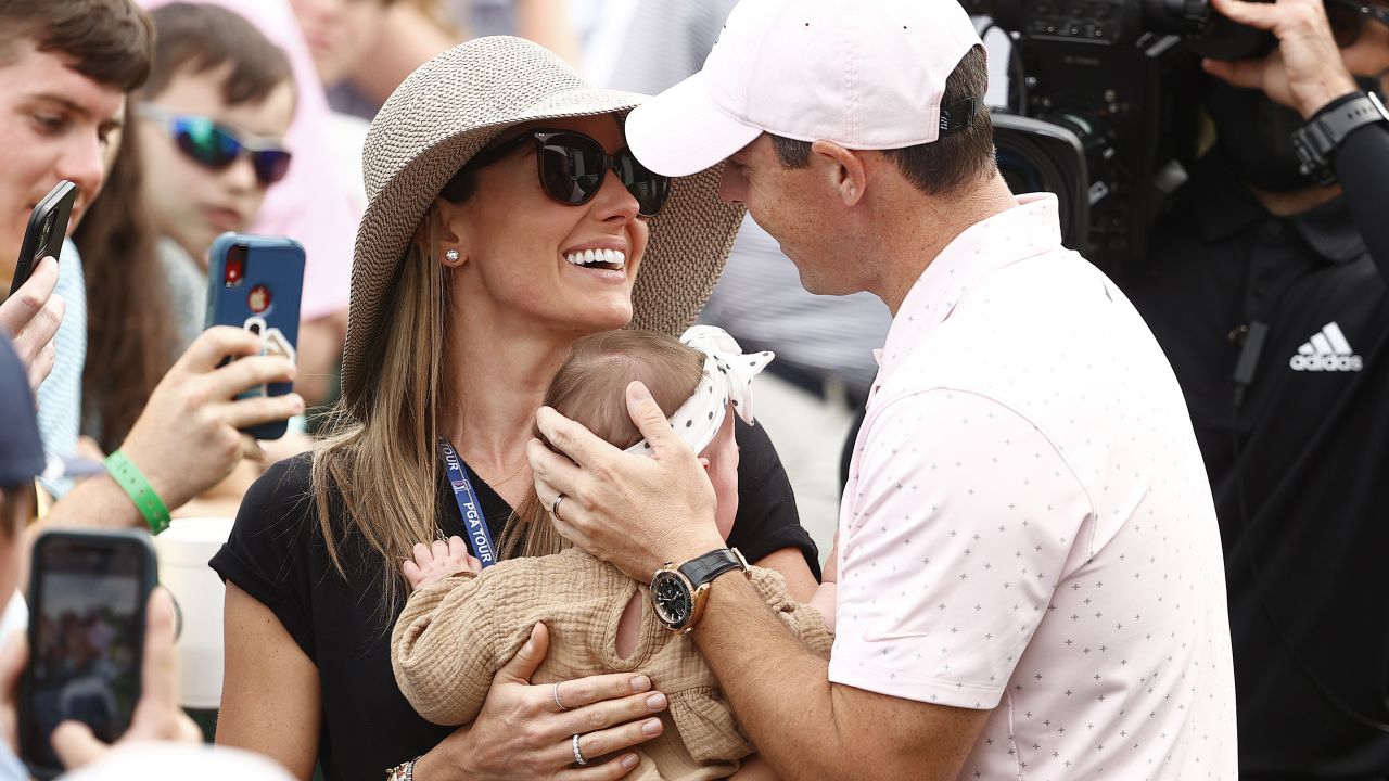 McIlroy celebrates with his wife Erica and daughter Poppy after winning the 2021 Wells Fargo Championship.