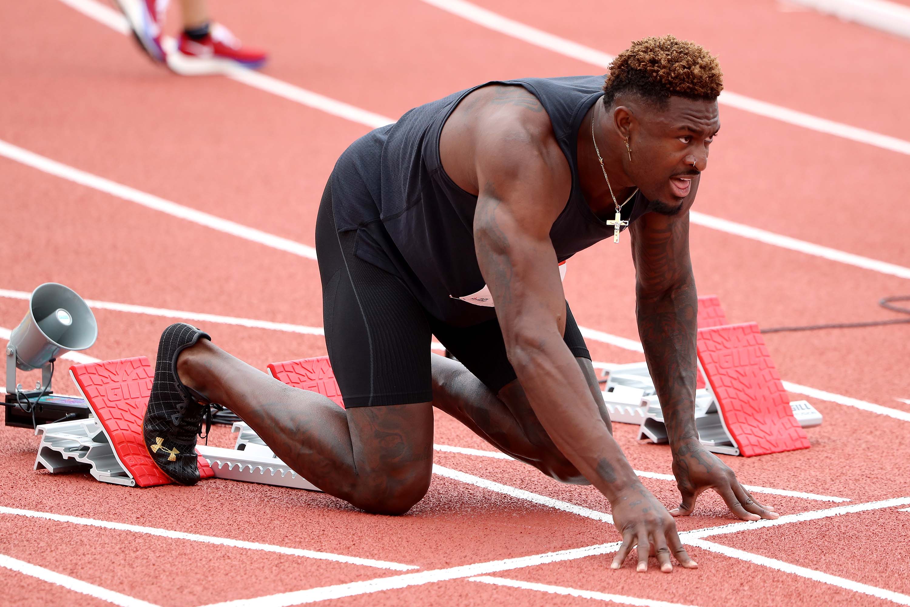 DK Metcalf keeps pace with Olympic-caliber sprinters in track debut