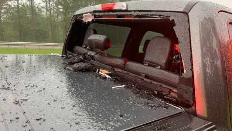 The back windshield was also blown out by a piece of pavement.