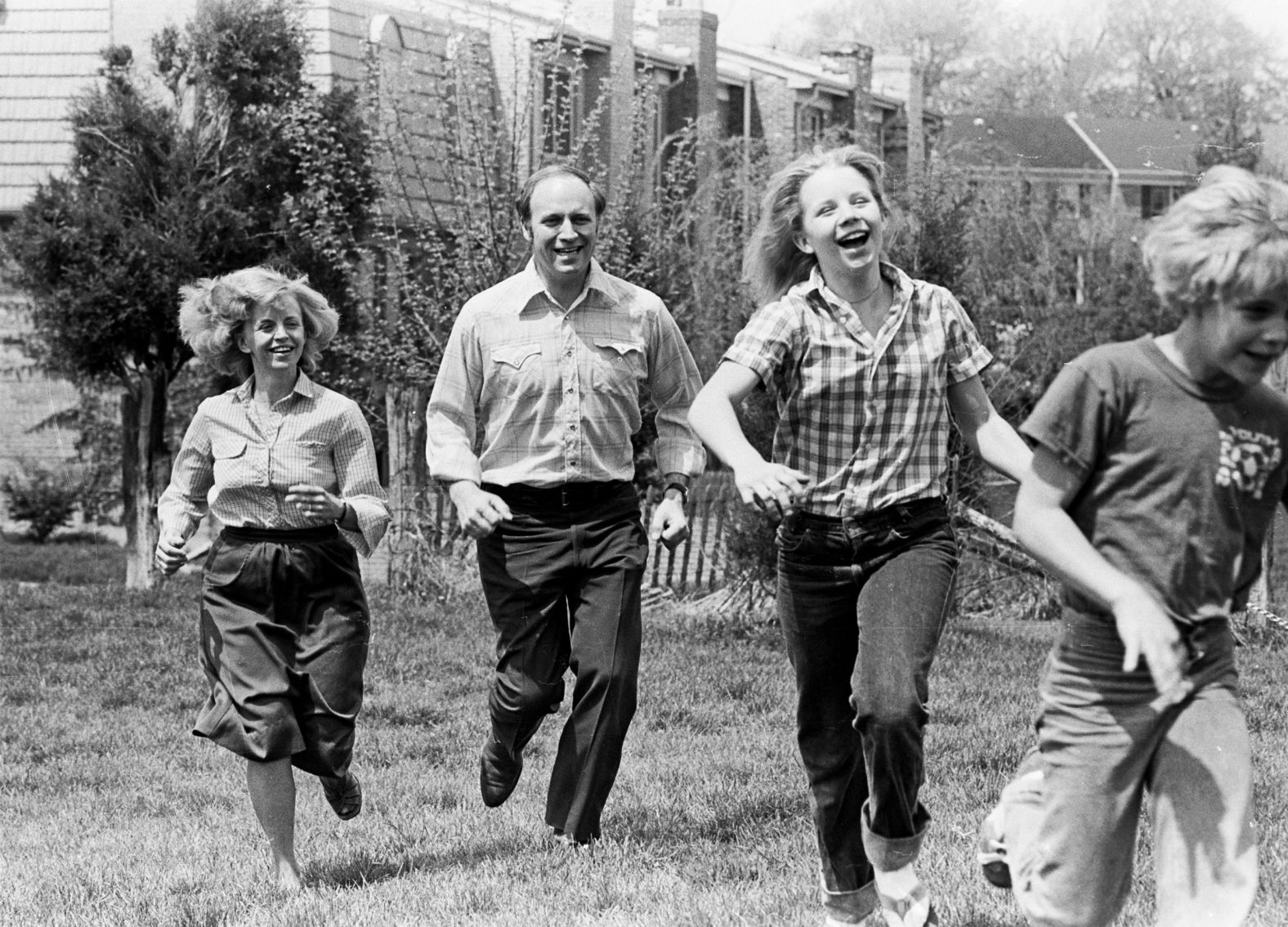 From left, Lynne, Dick, Liz and Mary Cheney run in the yard of their family home in McLean, Virginia, in 1980.