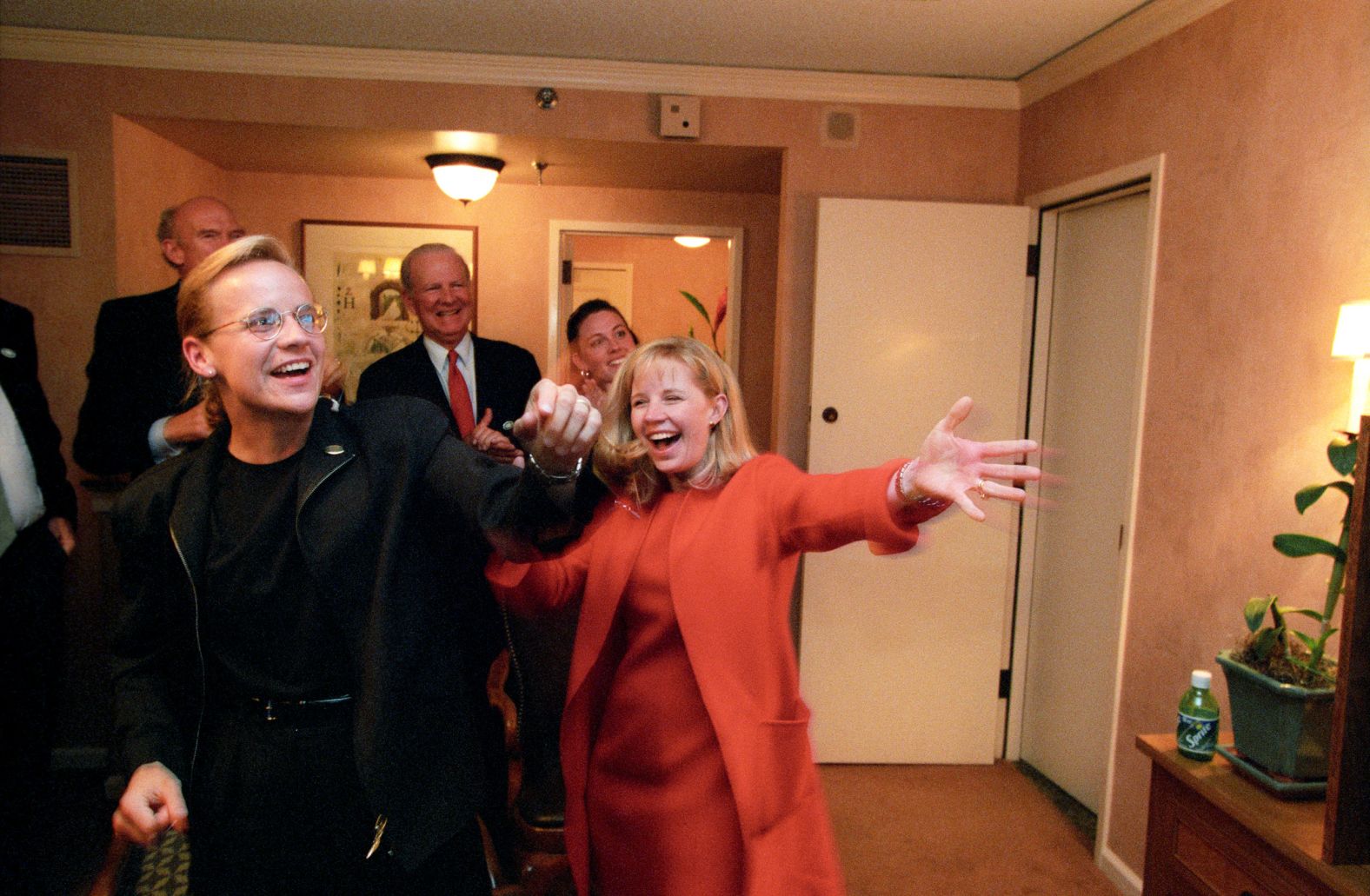 Liz Cheney, right, joins her sister as they watch election results from a hotel suite in Austin, Texas, in November 2000. Their father would eventually become vice president of the United States.