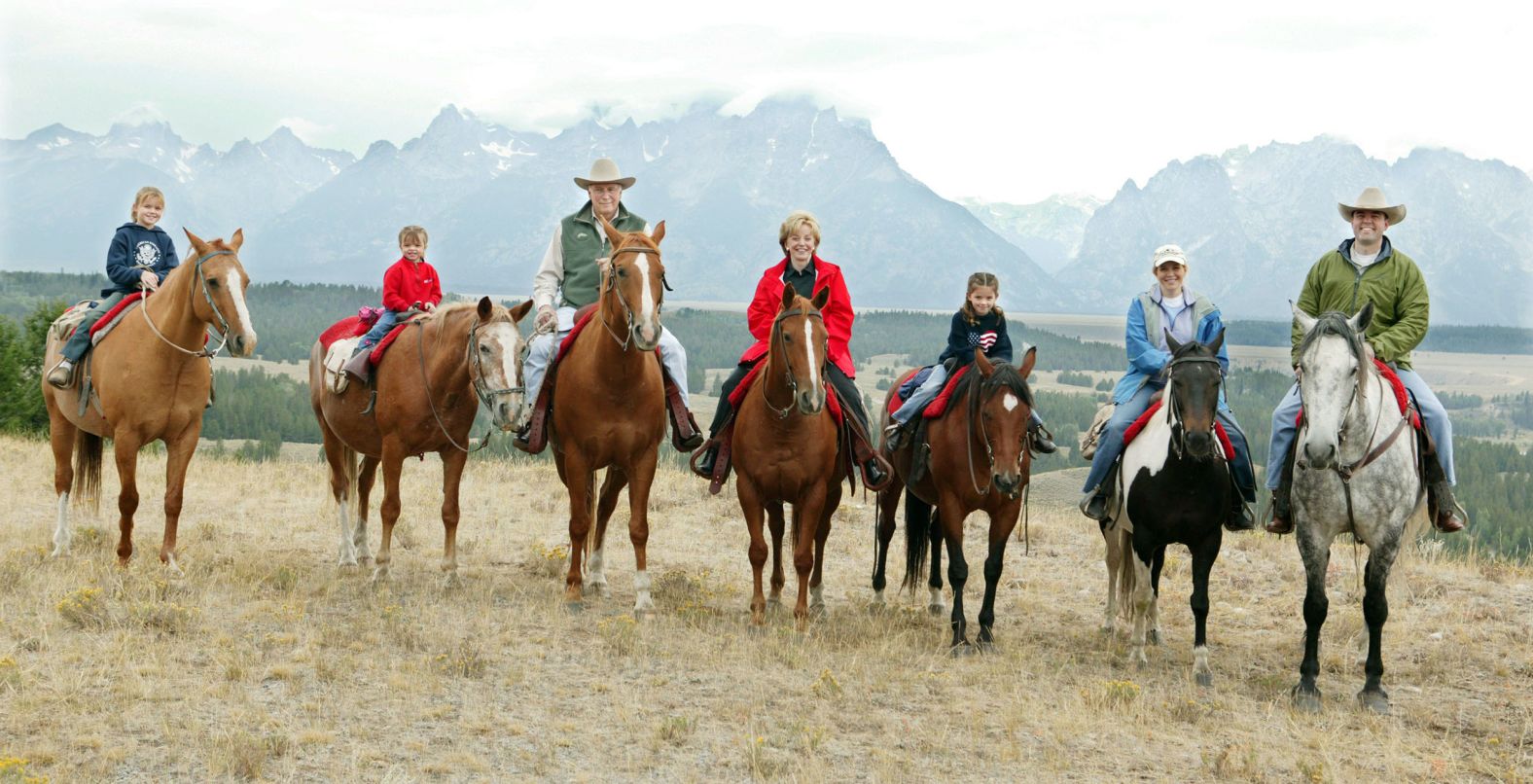 Liz Cheney, second from right, rides horses with her parents, her children and her husband in Moose, Wyoming, in August 2004. With her, from left, are her daughter Kate, her daughter Grace, her parents, her daughter Elizabeth and her husband, Phillip Perry. Cheney married Perry, a lawyer, in 1993. They have five children in all.