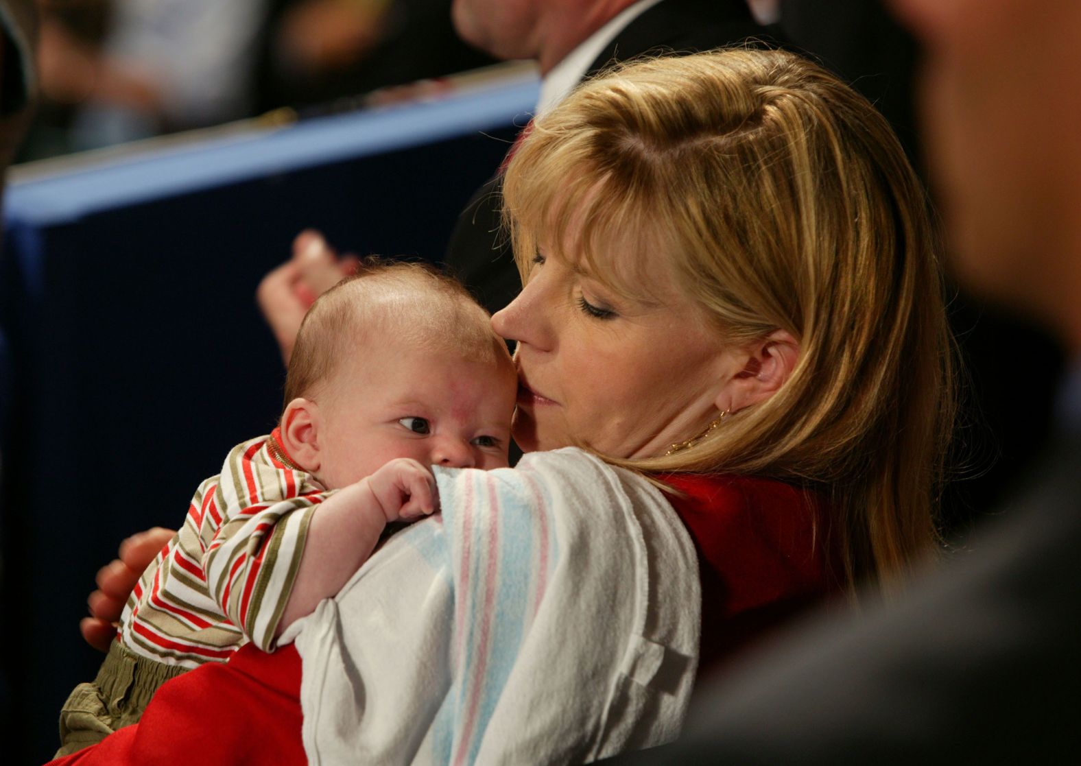 Cheney holds her 2-month-old son, Phillip, as President George W. Bush gave a speech at the Republican National Convention in 2004.