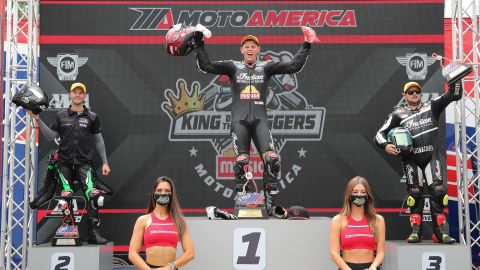 Riders celebrate on the King of Baggers winners podium. 