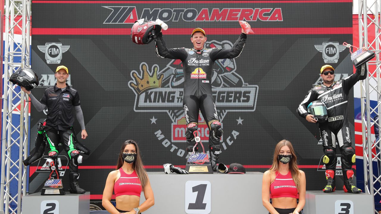 Riders celebrate on the King of Baggers winners podium.