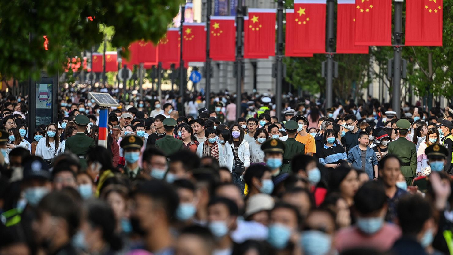 People walk along a pedestrian street during a Labor Day holiday in Shanghai on May 1.