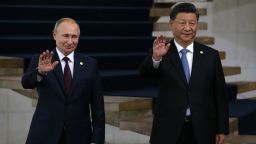 Russian President Vladimir Putin (L) and Chinese President Xi Jinping (R) wave during a welcoming ceremony on November 14, 2019 in Brasilia, Brazil. Leaders of Russia, China, Brazil, India and South Africa have gathered in Brasila for the BRICS Leaders Summit. (Photo by Mikhail Svetlov/Getty Images)