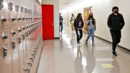  Returning students walk the hallway at Hollywood High School on April 27, 2021 in Los Angeles, California. 