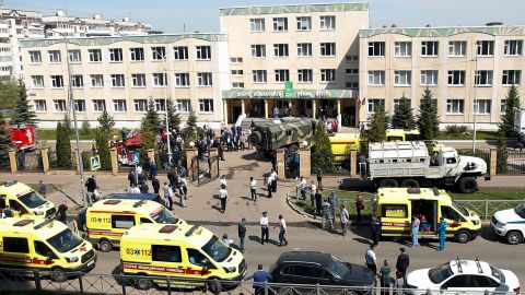 Ambulances and police cars are parked at a school after a shooting in Kazan, Russia.
