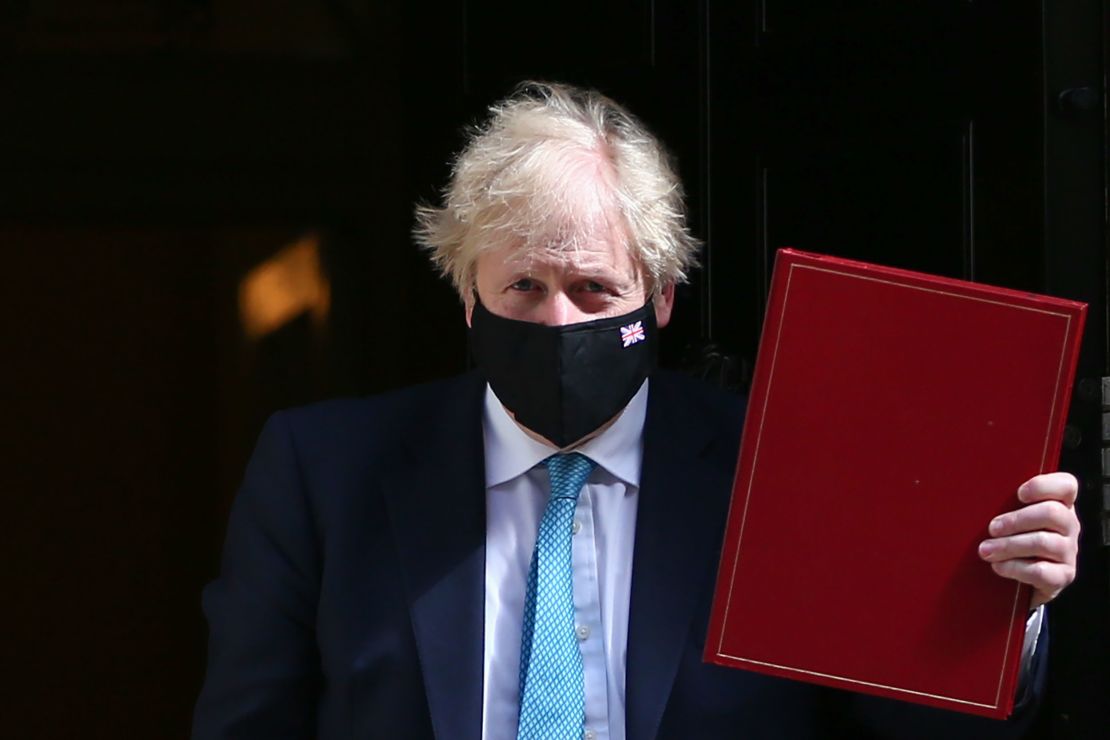 Boris Johnson leaves Downing Street to attend the speech on Tuesday, days after his party enjoyed convincing victories in local elections.