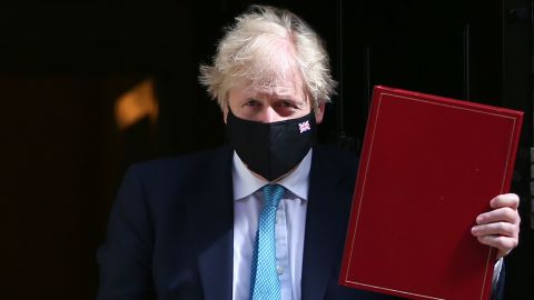 Boris Johnson leaves Downing Street to attend the speech on Tuesday, days after his party enjoyed convincing victories in local elections.