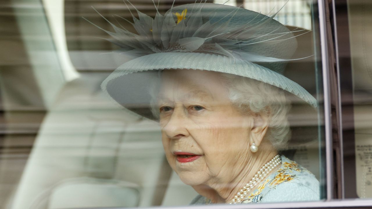 Queen Elizabeth II arrives at the scaled-back State Opening of Parliament on Tuesday. Usually, she would travel from Buckingham Palace by carriage.