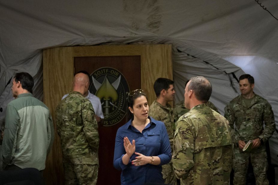 Stefanik discusses Iraq and Syria with US Army Maj. Gen. James Kraft while a congressional delegation visited Southwest Asia in April 2017.