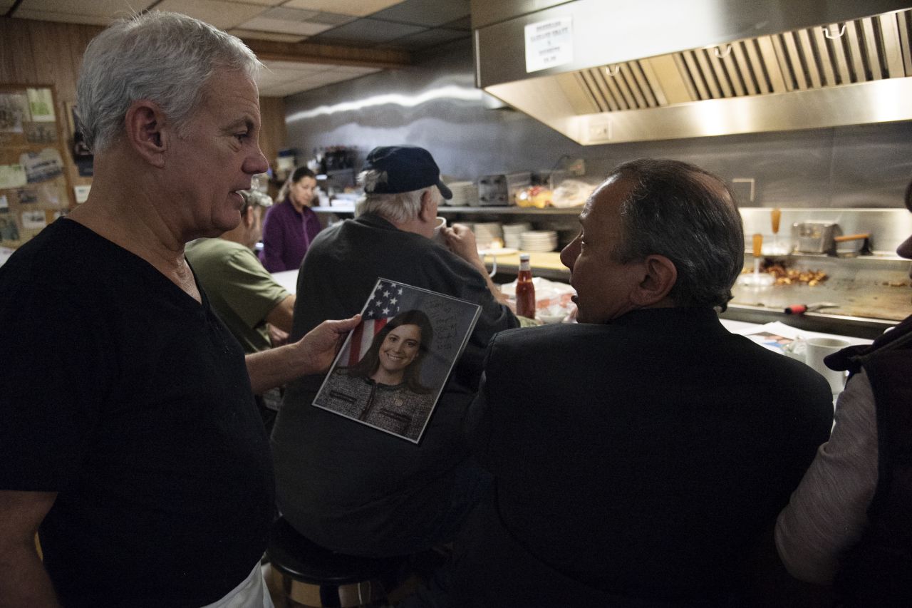 Diner owner Jerry Dimanno shows off an autographed photo of Stefanik at his restaurant in Glens Falls, New York, in December 2019.