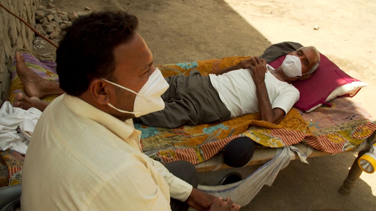 Dinesh Makwana and his father, Jivraj, residents of Chogath village in Gujarat, India, on May 9.
