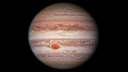 This visible-light image of Jupiter was created from data captured on 11 January 2017 using the Wide Field Camera 3 on the Hubble Space Telescope. Near the top, a long brown feature called a 'brown barge' extends 72,000 kilometers (nearly 45,000 miles) in the east-west direction. The Great Red Spot stands out prominently in the lower left, while the smaller feature nicknamed Red Spot Jr. (known to Jovian scientists as Oval BA) appears to its lower right.