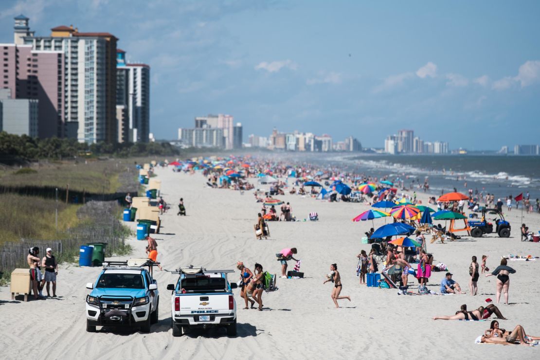 Beach goers on the sand in Myrtle Beach, South Carolina, on May 23, 2020