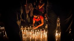 FILED - 04 May 2021, Colombia, Pereira: People covering their mouths light candles during a rally for demonstrator Lucas Villa, who was seriously injured during a protest against the government. The 37-year-old yoga teacher was reportedly hit by eight bullets during the protest, according to local media reports. On 11.05. it was informed, Villa succumbed to his injuries. (to dpa "Symbol of the protests: Demonstrator in Colombia dies after shots" of 11.05.2021) Photo: Juan Pablo Otalvaro M/dpa (Photo by Juan Pablo Otalvaro M/picture alliance via Getty Images)