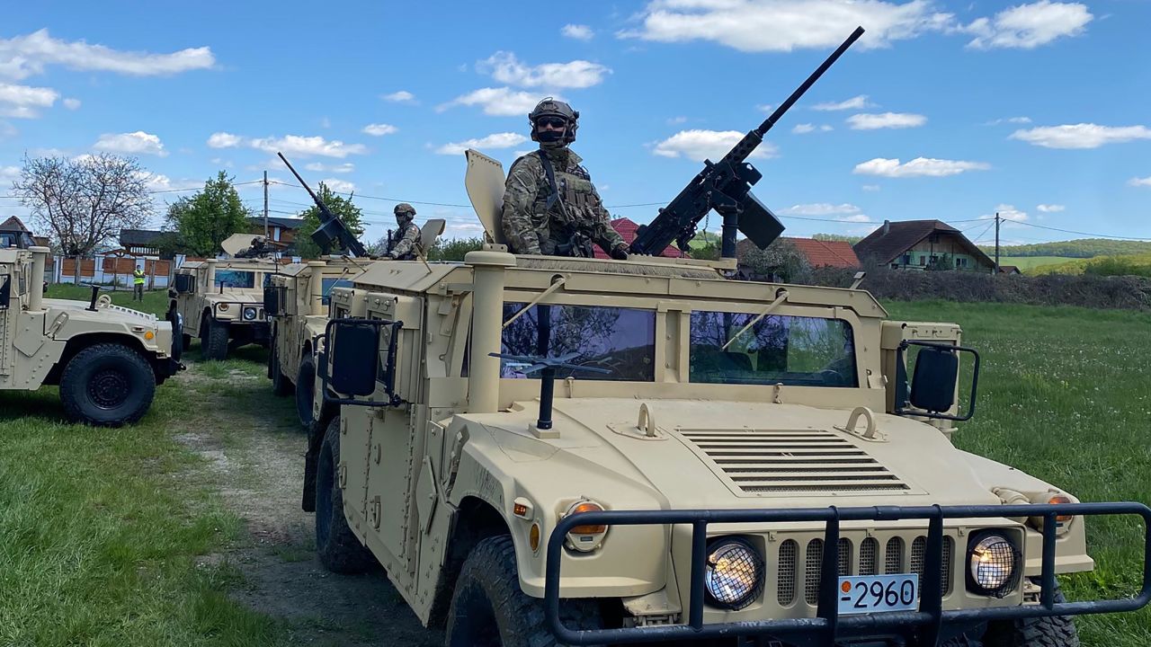 Humvees and troops prepare to join a military training with US, Ukrainian and Romanian special forces in Reghin, Romania.