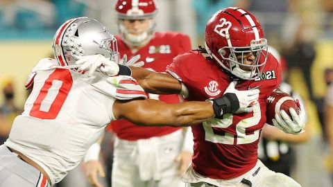 Najee Harris rushes against the  Ohio State Buckeyes during the second quarter of the College Football Playoff National Championship game.