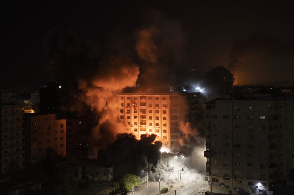 Smoke caused by Israeli airstrikes are seen at a residential building in Gaza City.