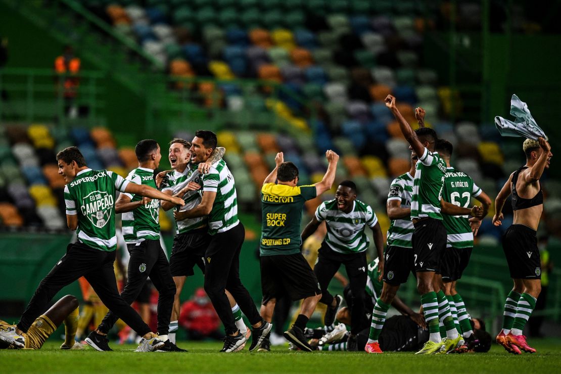 Sporting Lisbon players celebrate after winning the title. 