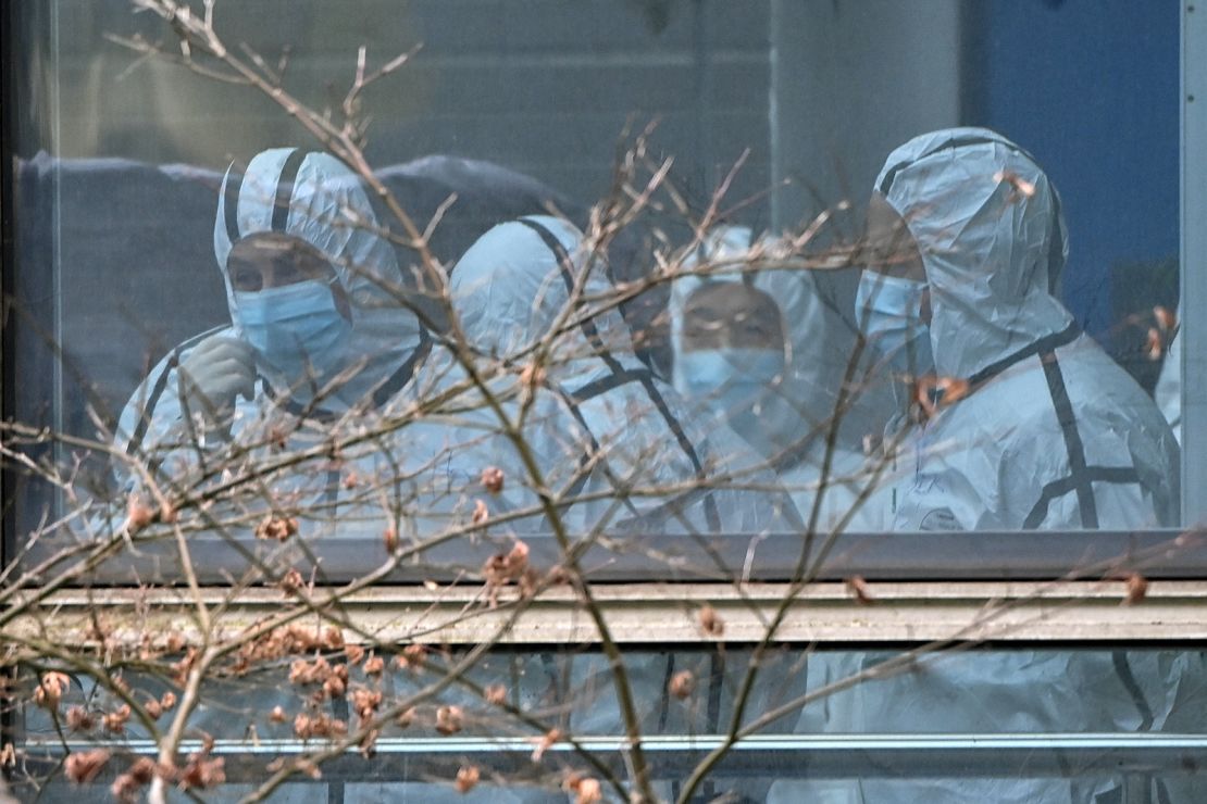 Members of the WHO team investigating the origins of the coronavirus visit the Hubei Center for animal disease control and prevention in Wuhan, China, on February 2, 2021.
