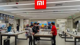 Customers experience Mi 11 Ultra smartphones at a Xiaomi store on March 30, 2021 in Shanghai, China.