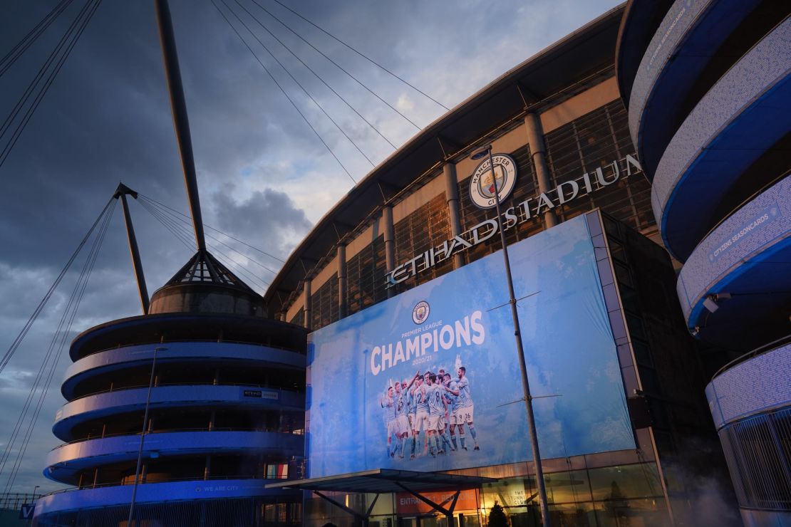 A large display outside Etihad Stadium reads "Champions" as Manchester City has been confirmed as Premier League champions.