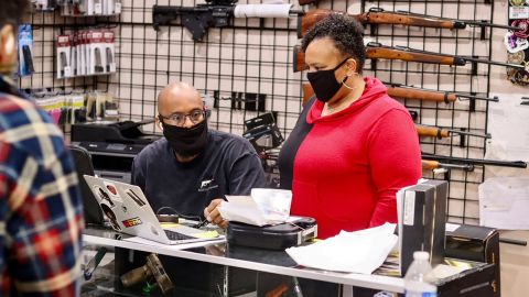 NAAGA executive board member Geneva Solomon (right) and her husband Jonathan work behind the counter at Redstone Firearms in Burbank, California.