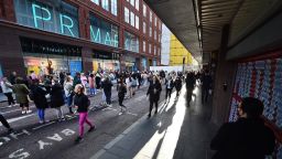 BELFAST, NORTHERN IRELAND - APRIL 30: Thousands of shoppers wait for Primark to open for the first time since the latest lockdown on April 30, 2021 in Belfast, Northern Ireland. Non essential retail shops and bars with outdoor facilities reopen today in the province as Covid-19 restrictions are eased. (Photo by Charles McQuillan/Getty Images)