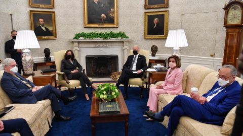 US President Joe Biden (3rd R) and US Vice President Kamala Harris (L) meet with members of Congressional Leadership, including Senate Majority Leader Chuck Schumer (R), Speaker of the House Nancy Pelosi (2nd R) and Senate Minority Leader Mitch McConnell, to discuss policy areas of mutual agreement, in the Oval Office of the White House in Washington, DC, on May 12, 2021. 