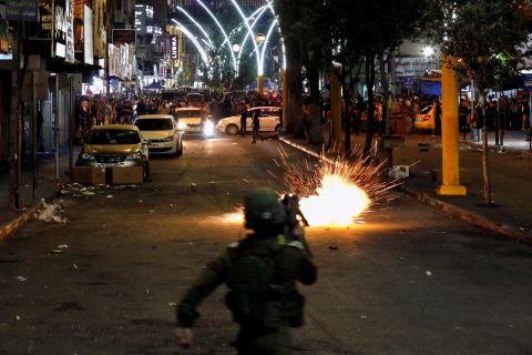 A stun grenade fired by Israeli forces explodes as Palestinians take part in an anti-Israel protest in Hebron, West Bank, on May 11.